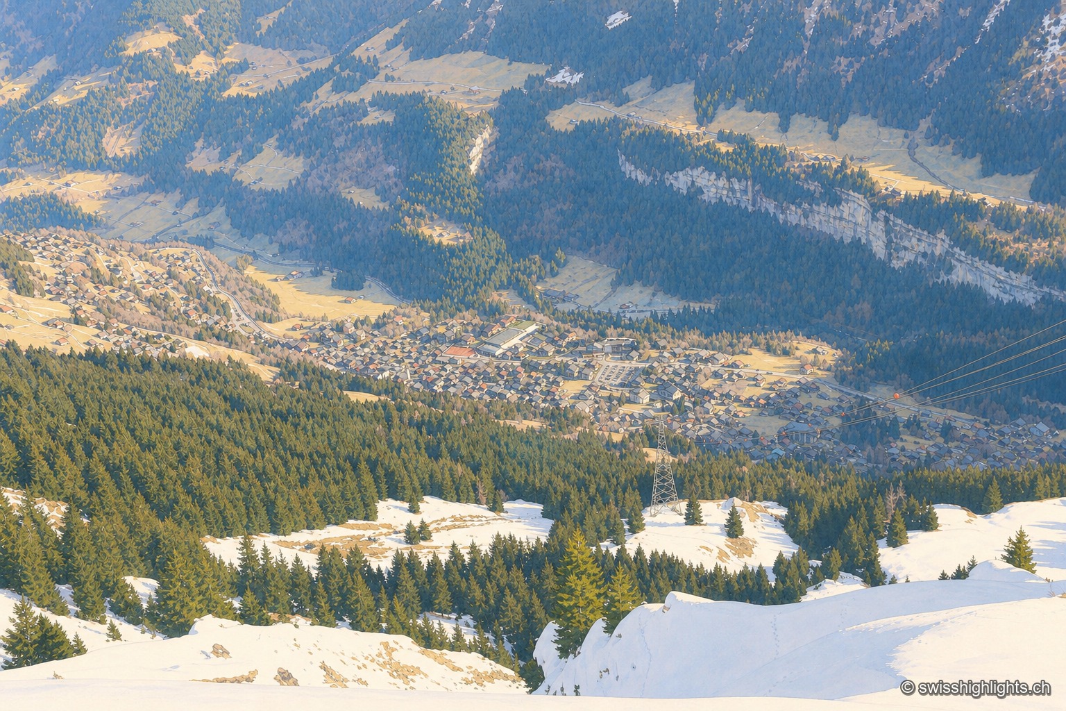 Champéry sous la neige vu depuis les hauteurs enneigées de Planachaux : le village aux toits blancs s'étale dans la vallée, entouré de sapins couverts de neige et de sommets alpins immaculés sous un ciel clair.